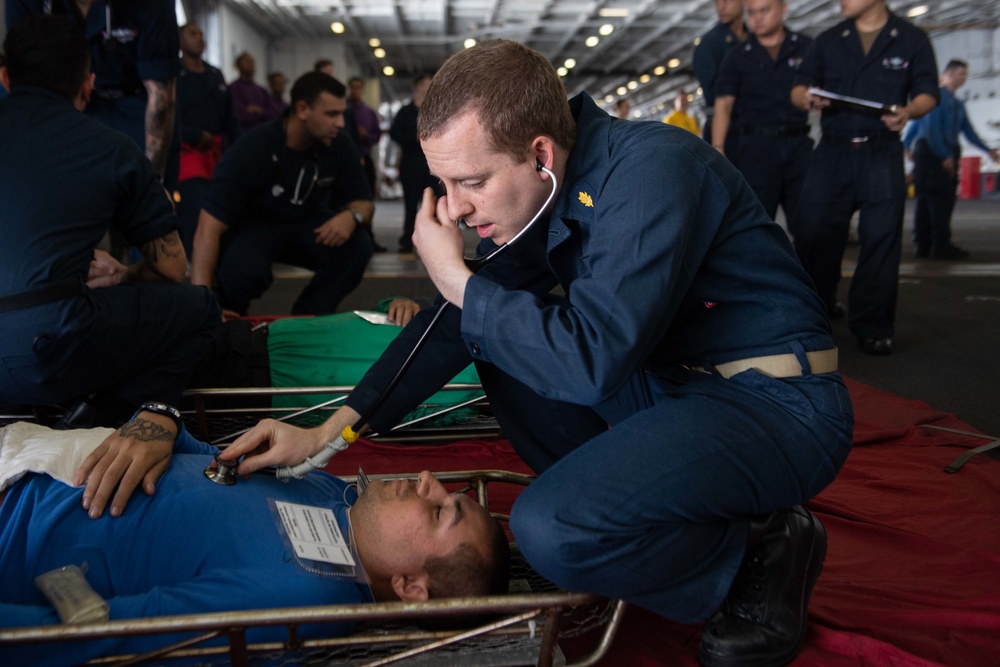 U.S. Sailors participate in a mass casualty drill