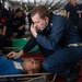 U.S. Sailors participate in a mass casualty drill