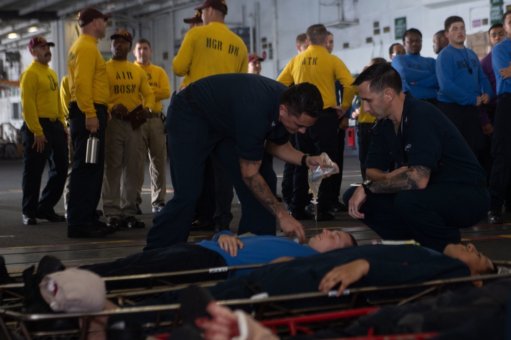 U.S. Sailors participate in a mass casualty drill