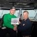 U.S. Sailor poses as Sailor of the Day