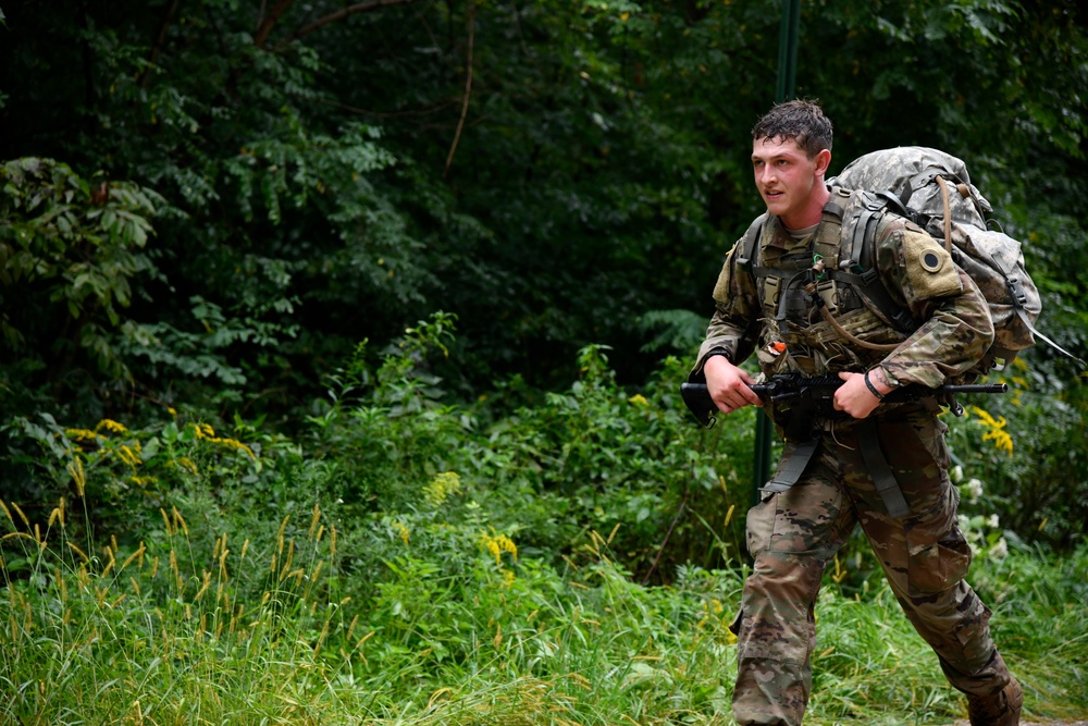 Spc. Mike Bell displays stoic determination during 12-mile ruck