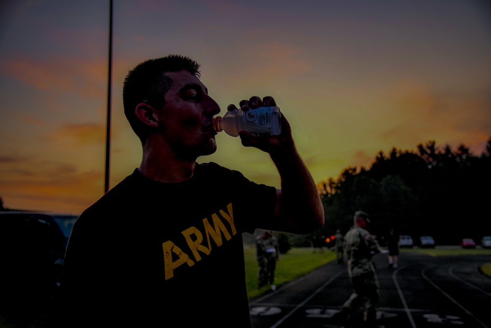 Private 1st Class Tyler Royston hydrates after the APFT