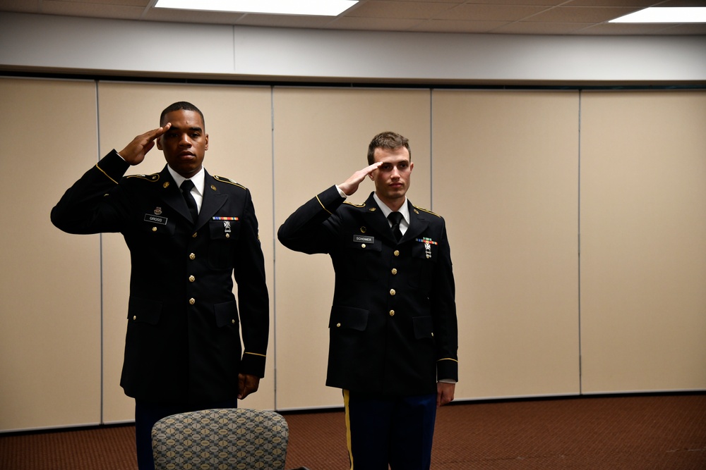 Soldiers salute the president of the board