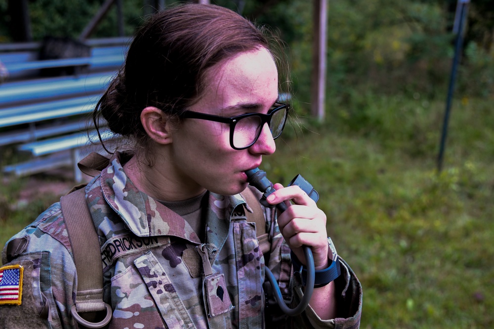 Soldier hydrates after grueling land navigation