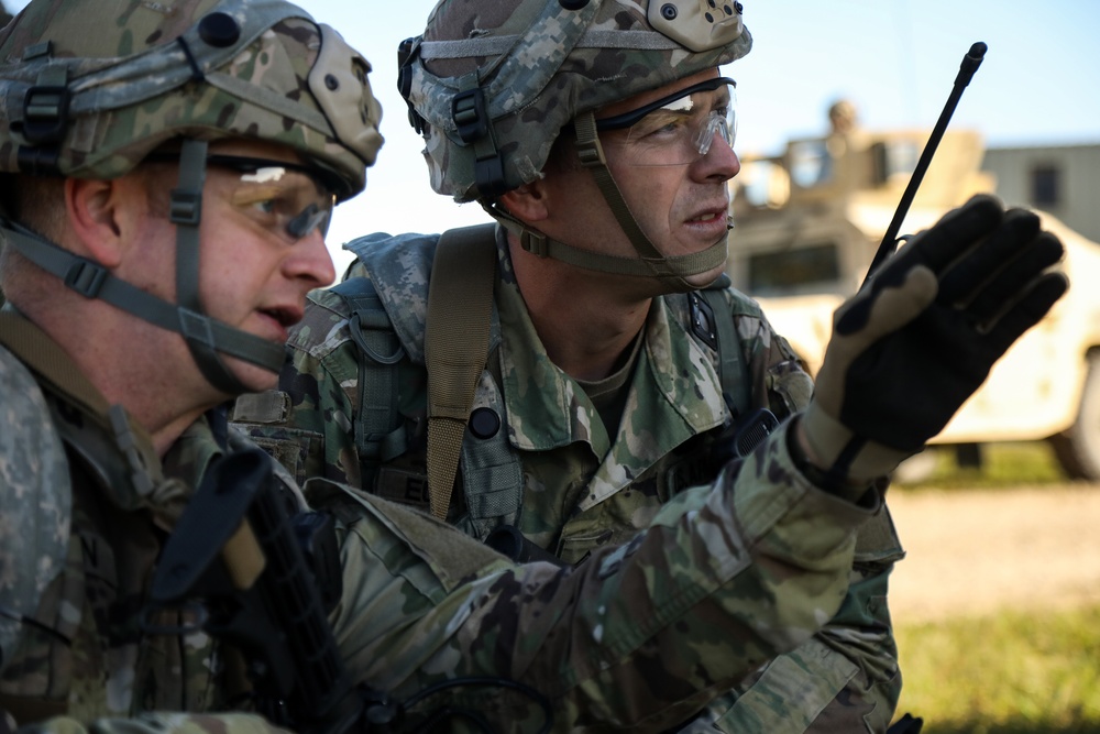 U.S. Soldiers discuss mission strategies during Saber Junction 19