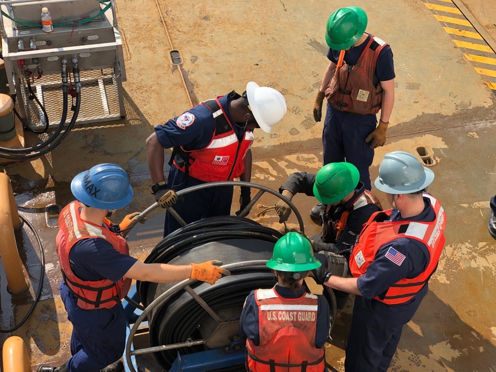 Coast Guard members conduct Spilled Oil Recovery System deployment training in Sitka, Alaska