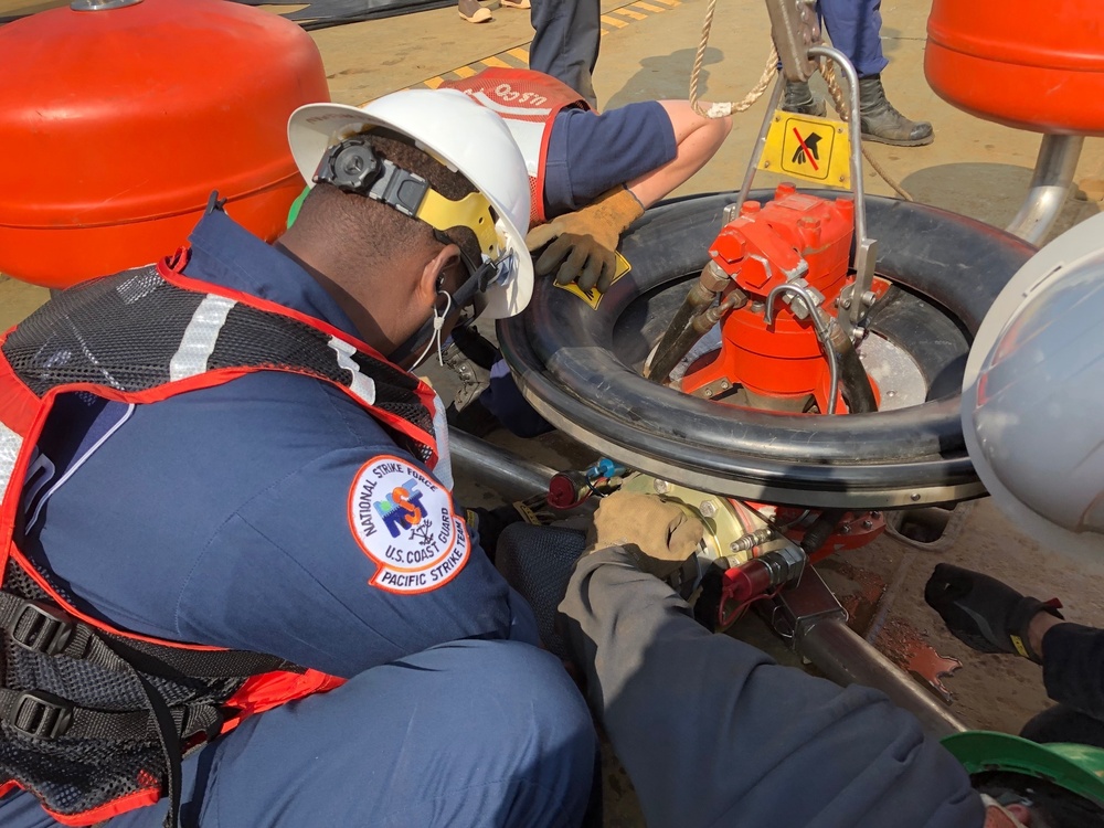 Coast Guard members conduct Spilled Oil Recovery System deployment training in Sitka, Alaska