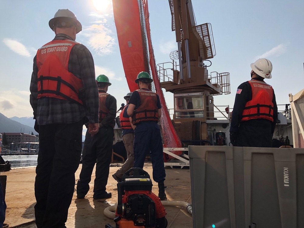 Coast Guard members conduct Spilled Oil Recovery System deployment training in Sitka, Alaska