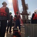 Coast Guard members conduct Spilled Oil Recovery System deployment training in Sitka, Alaska