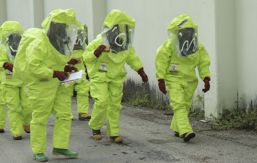 Service members and civilians participate in hazardous operations training