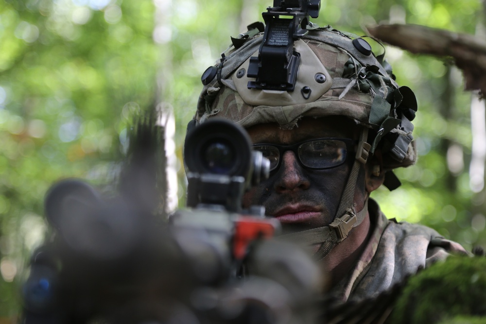 A U.S. Soldier scans his sector of fire during Saber Junction 19