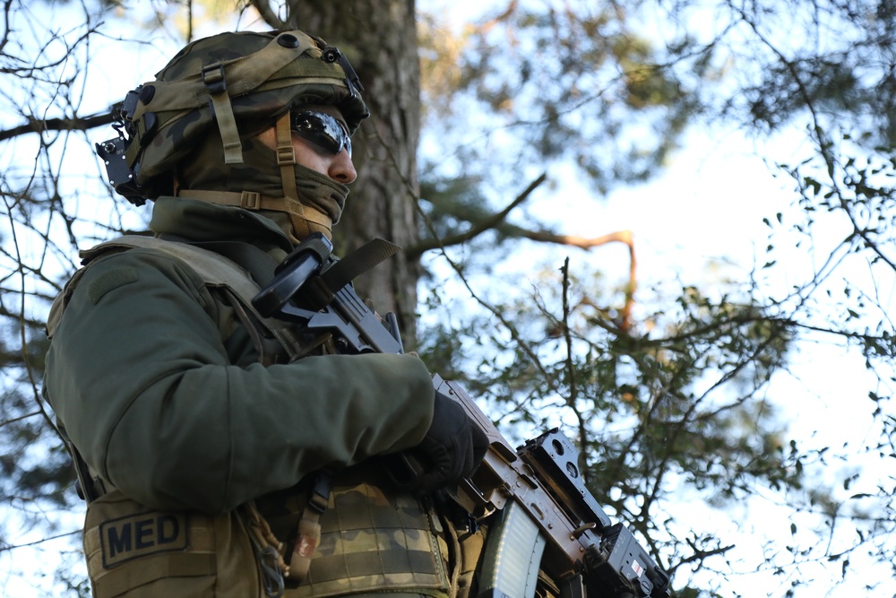 A Polish soldier provides security during Saber Junction 19