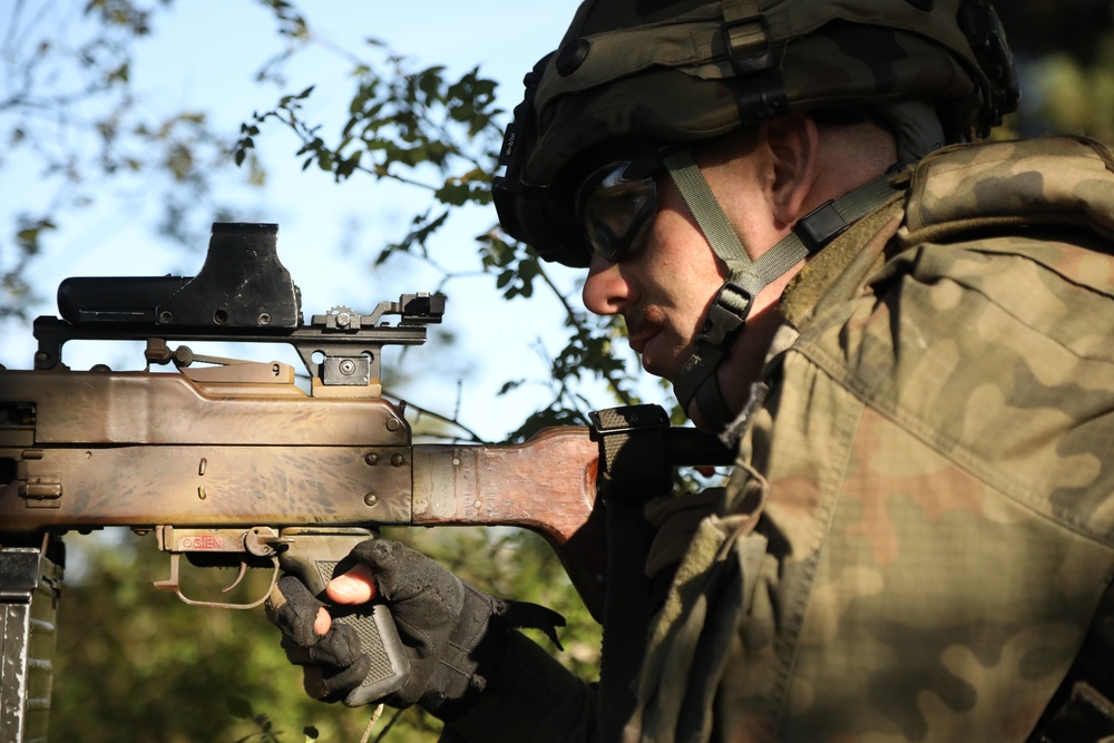 A Polish soldier provides security during Saber Junction 19