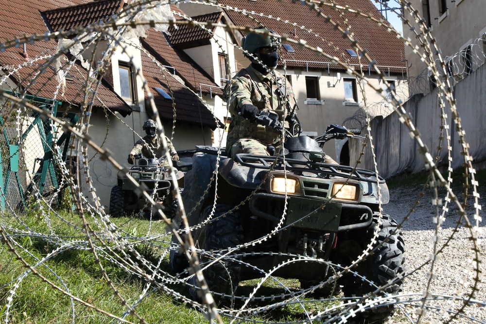 U.S. Soldiers maneuver through a noncombatant evacuation operation during Saber Junction 19