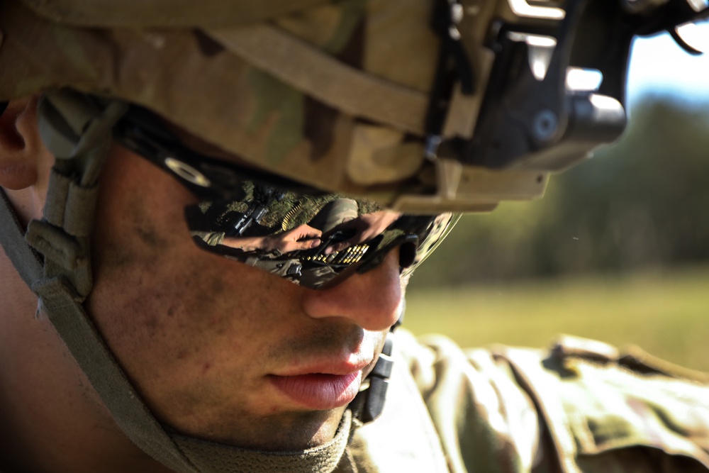 U.S. Army Spc. Aaron Sanders reloads ammunition during Saber Junction 19