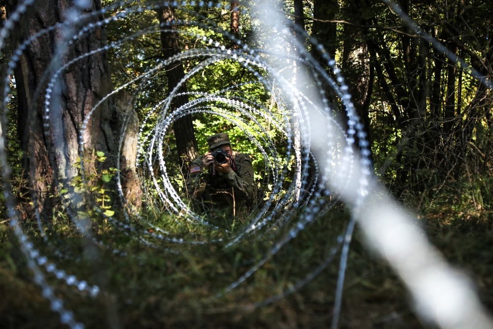 U.S. Army Spc. Shawn Pierce captures a photo during Saber Junction 19