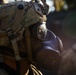 A U.S. Soldier dons his gas mask during Saber Junction 19