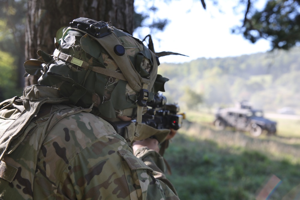 A U.S. Soldier reacts to fire during Saber Junction 19