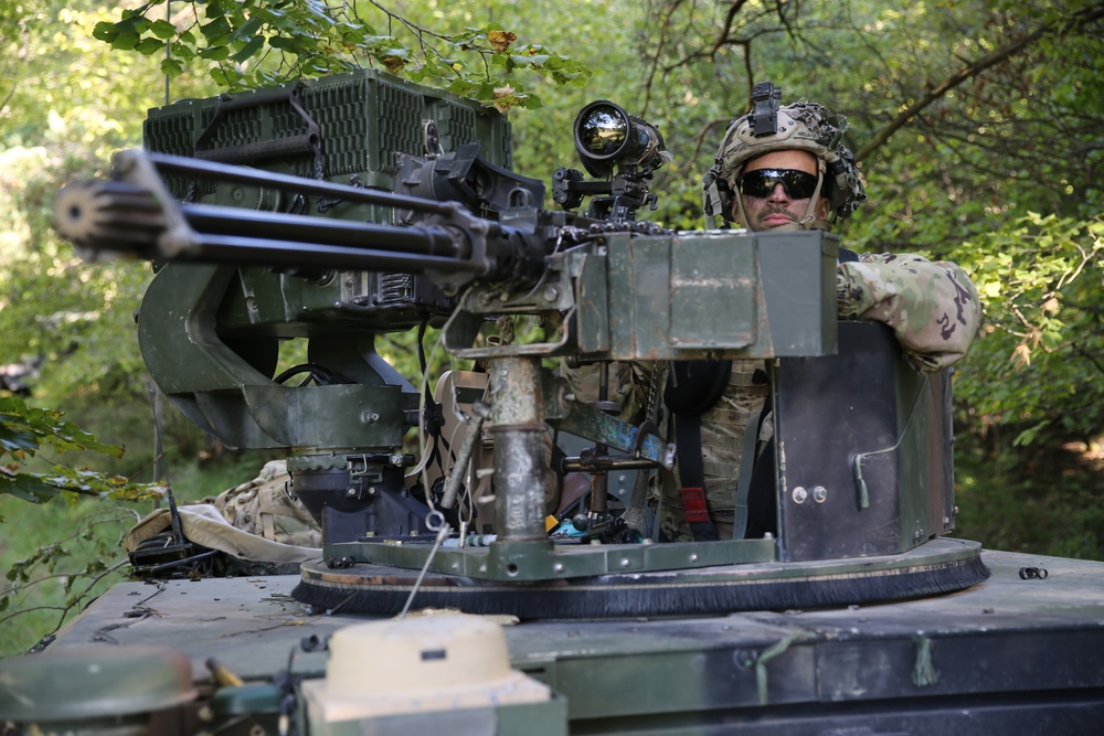 U.S. Army Spc. Jorge Miliani provides security during Saber Junction 19