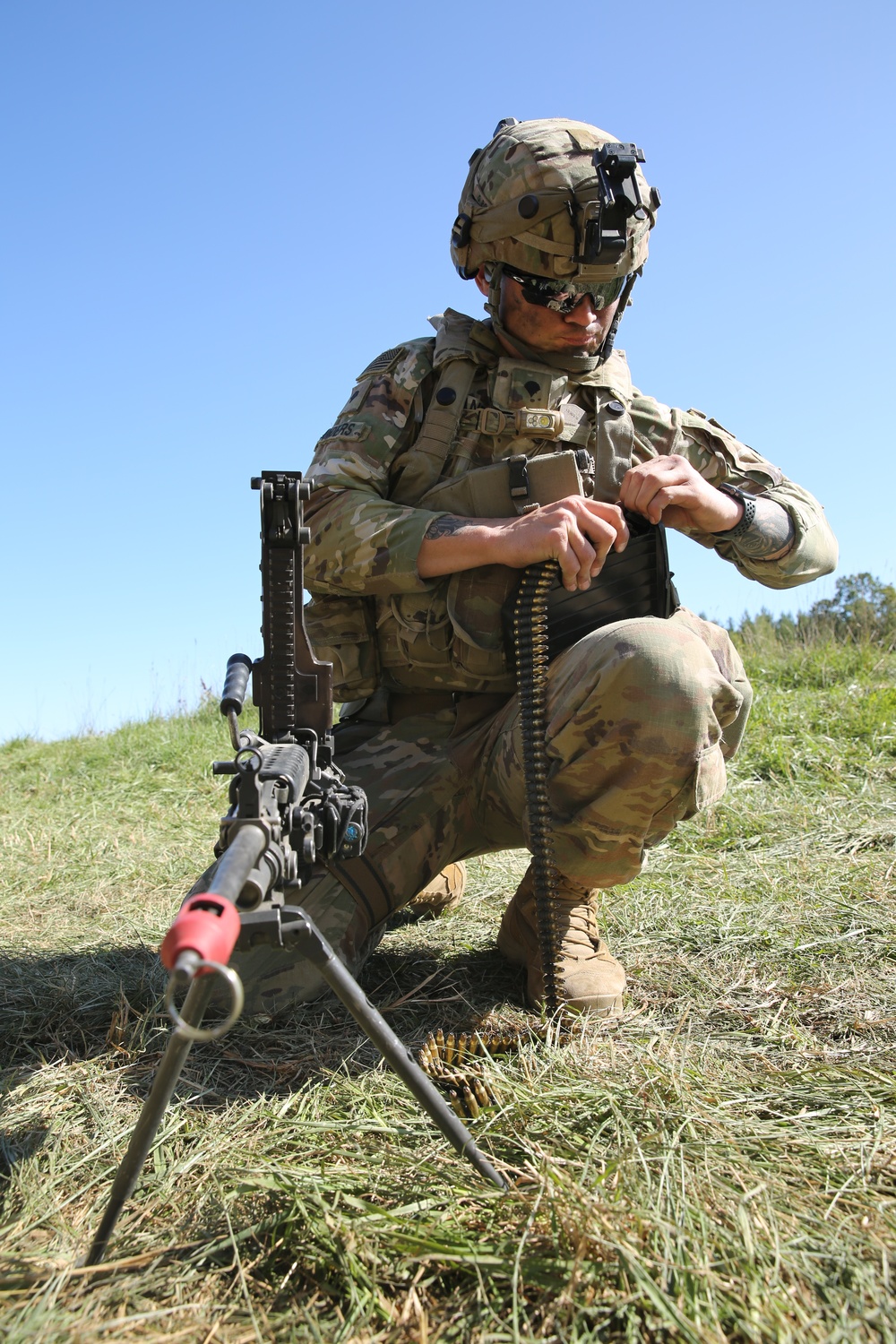 U.S. Army Spc. Aaron Sanders prepares ammunition during Saber Junction 19