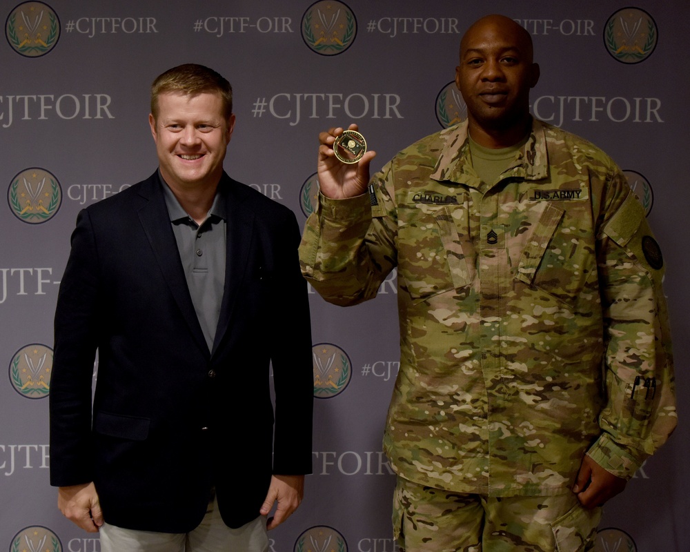 Acting Secretary of the Army coins Sgt. 1st Class Josiah Charles