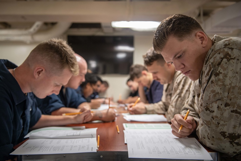 Sailors Take Advancement Exam Aboard USS Harpers Ferry