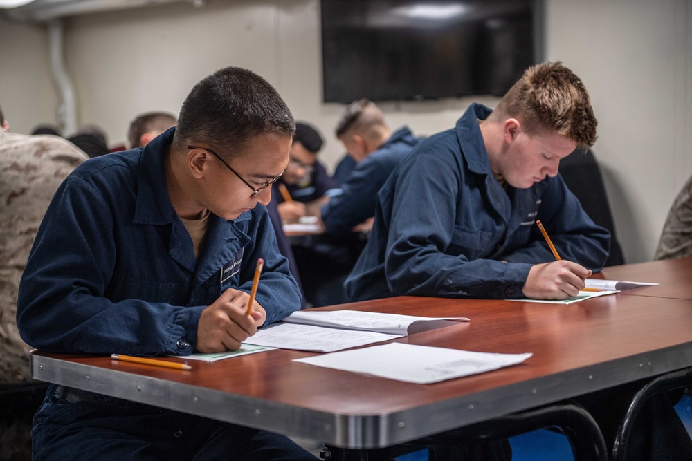 Sailors Take Advancement Exam Aboard USS Harpers Ferry