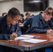 Sailors Take Advancement Exam Aboard USS Harpers Ferry