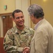 Major Jeremy D. Broussard greets psychologist Dr. Alan Berkowitz