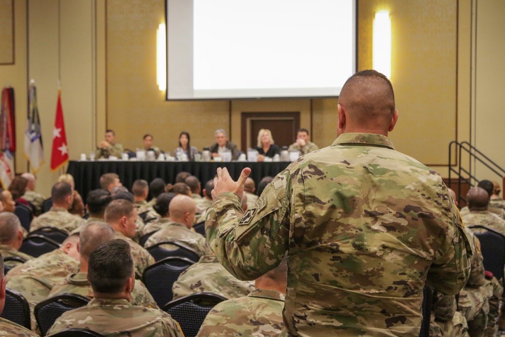 A Soldier poses a question to the panel of speakers at the SHARP Leadership Forum.