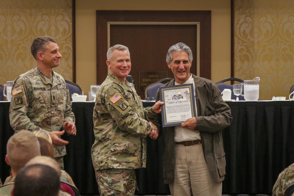 Dr. Alan Berkowitz is presented a Certificate of Appreciation by Lieutenant General Paul J. LaCamera, Commanding General of XVIII Airborne Corps and Fort Bragg
