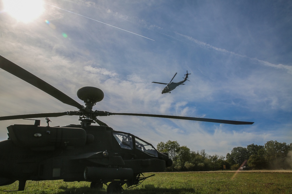 U.S. Soldiers fly an AH-64D Apache Longbow helicopter during Saber Junction 19