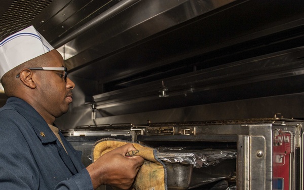 USS Normandy Sailor Prepares Lunch