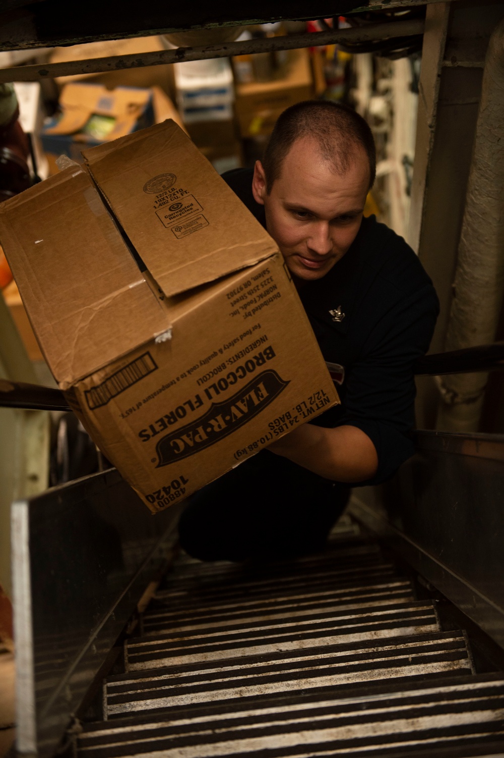 USS San Jacinto Sailors Move Stores