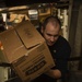 USS San Jacinto Sailors Move Stores