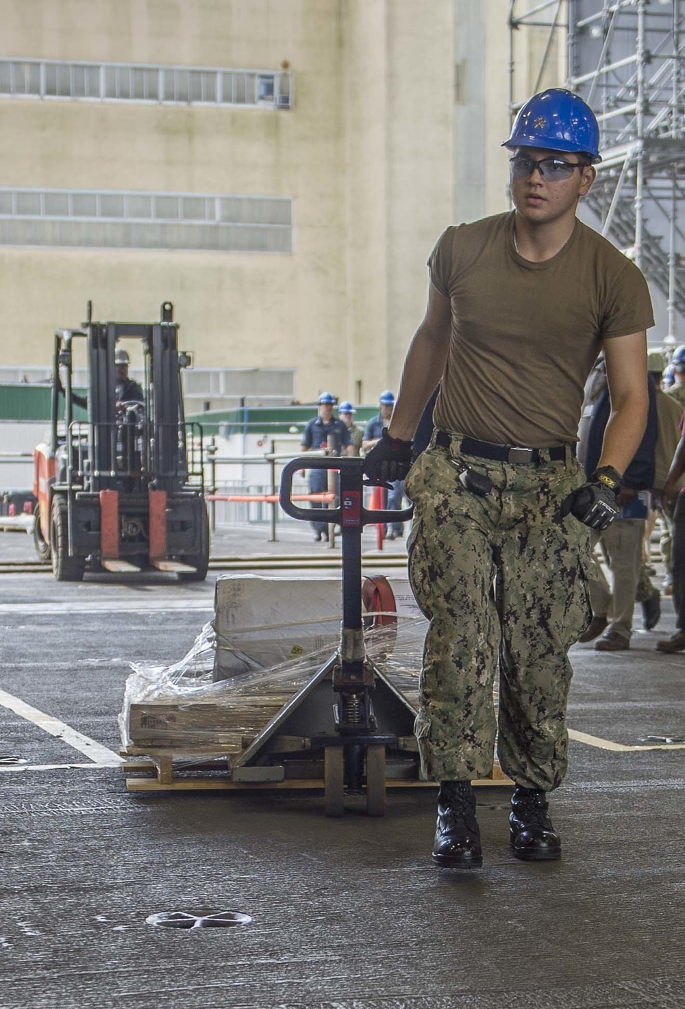 GHWB Sailor Brings Packages Onto Flight Deck