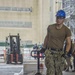 GHWB Sailor Brings Packages Onto Flight Deck