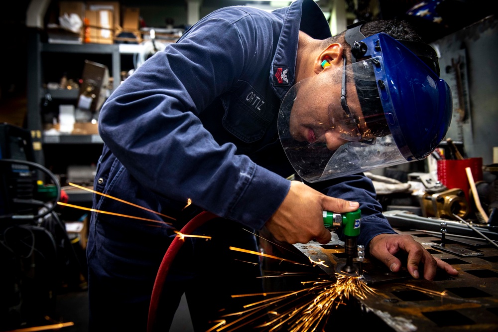 Sailor Conducts Maintenance