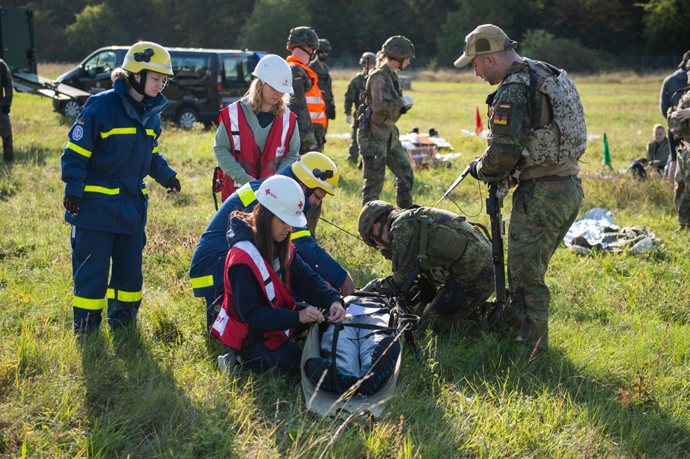 Soldiers and Civillians Attend to a Simulated Casualty During Excercise Cobra Strike 2019