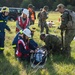 Soldiers and Civillians Attend to a Simulated Casualty During Excercise Cobra Strike 2019