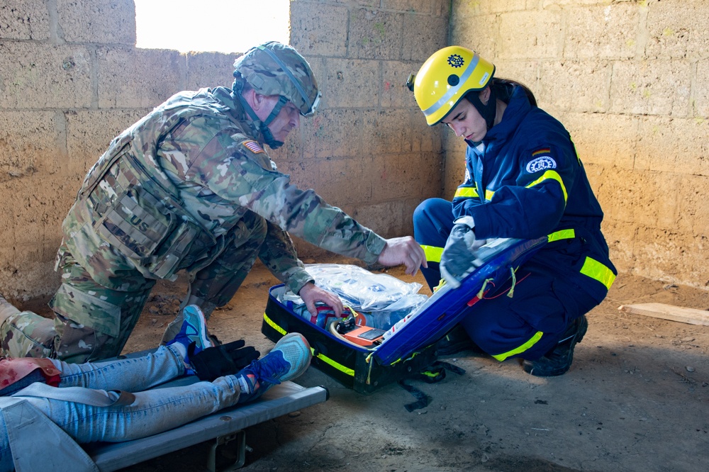 A U.S. Army Soldier works with with the Technisces Hilfswerk during Cobra Strike 2019