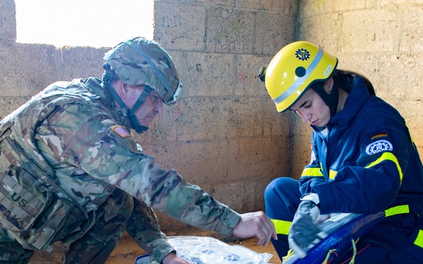 A U.S. Army Soldier works with with the Technisces Hilfswerk during Cobra Strike 2019