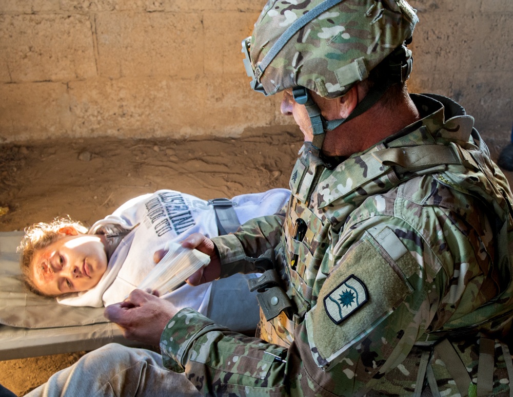 Sgt. Marc Stedtler Applies First Aid During Excercise Cobra Strike 2019