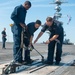 Sailors conduct maintenance