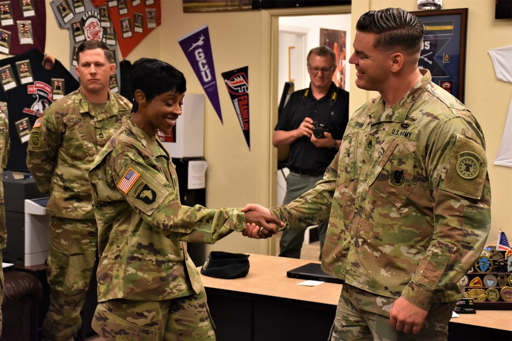CSM Gavia presents challenge coin for recruiting excellence