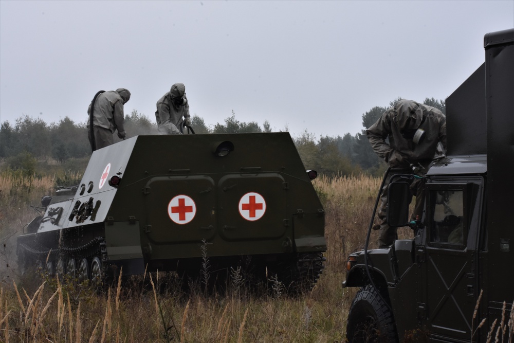 Ukraine soldiers decontaminate vehicles during RT19 FTX