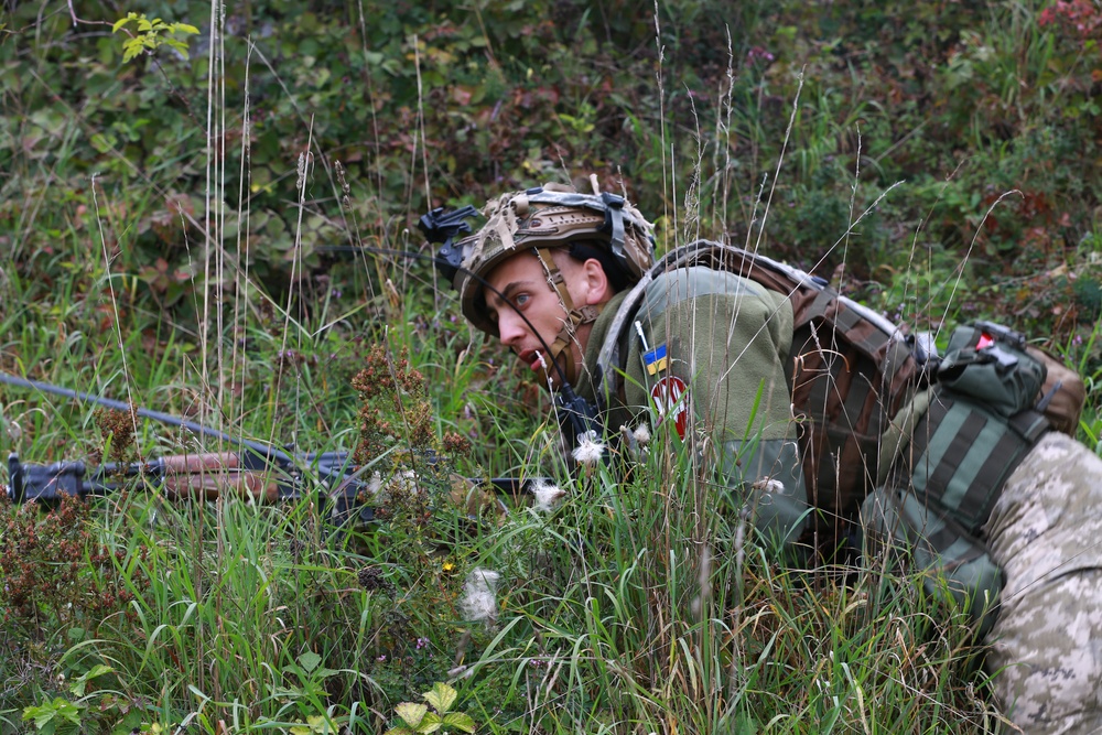 A Ukrainian soldier holds a battle position during  Saber Junction 19