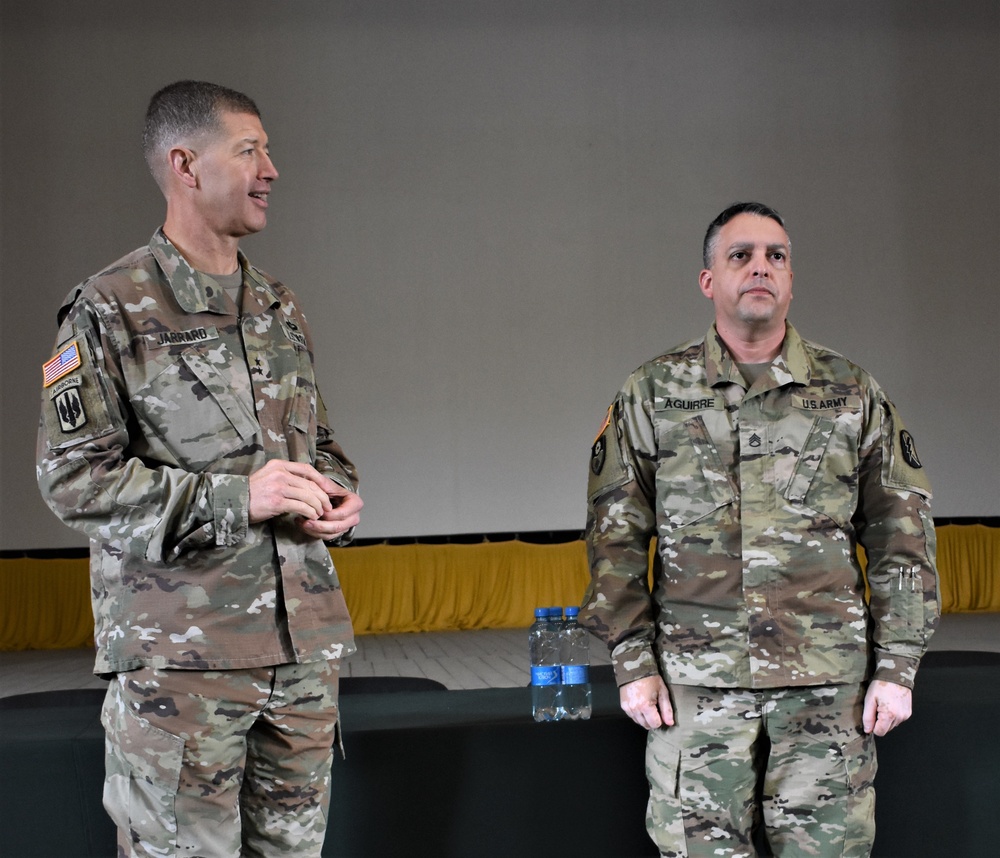 Maj. Gen. Jarrard awards soldiers with his service coin during RT19