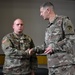 Maj. Gen. Jarrard awards soldiers with his service coin during RT19