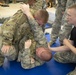 Godzilla Class officer Trainees spar during combatives class